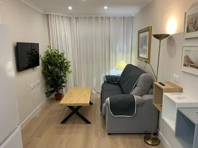 a living room with a couch and a table at Mirador de Sanlucar 3 in Sanlúcar de Barrameda