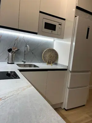 a kitchen with a sink and a refrigerator at Mirador de Sanlucar 3 in Sanlúcar de Barrameda