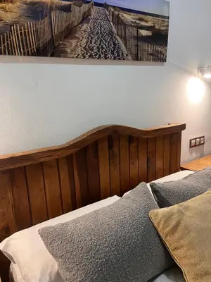 a bedroom with a bed and a painting on the wall at El Patio de María 2 in Bornos