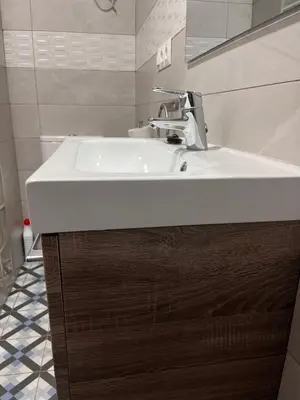 a bathroom with a white sink and a toilet at El Patio de María 2 in Bornos