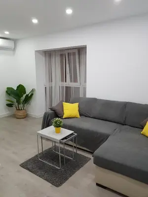 a living room with a couch and a table at Playa La Caleta in Cádiz