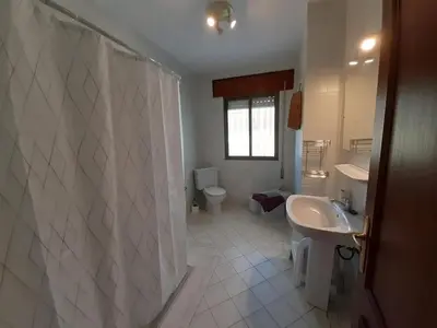 a bathroom with a tub and a sink and a toilet at Casa Toya in Arcos de la Frontera