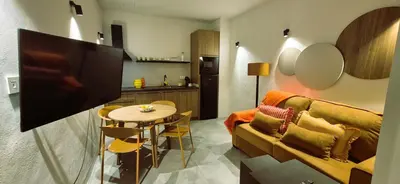 a living room with a couch and a table at Apartamentos Robles 4 by Gades Gestión in Cádiz
