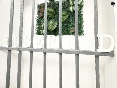 a sign that reads garden behind a fence with vegetables at Penthouse Libertad Grupo AC Gestion in Cádiz