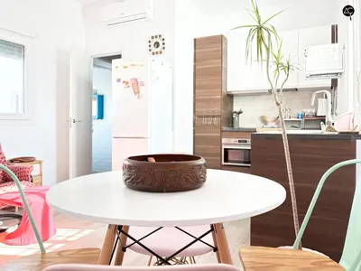 a kitchen with a table with a potted plant on it at Penthouse Libertad Grupo AC Gestion in Cádiz
