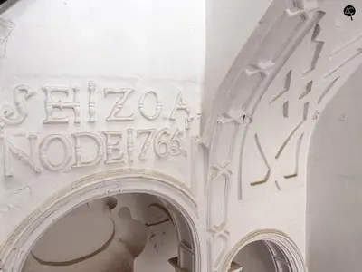 a white building with a sign on the side of it at Penthouse Libertad Grupo AC Gestion in Cádiz
