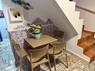 a kitchen with a washing machine and a sink at Apartamento Pacífico in Chipiona