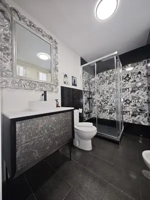 a bathroom with a toilet and a sink and a shower at El Rincón de Ro Little Apartments in Cádiz