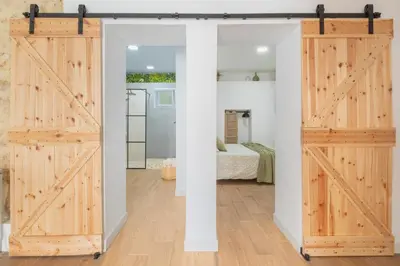 a pair of sliding doors in a bedroom at Mirador de la Peña in Arcos de la Frontera