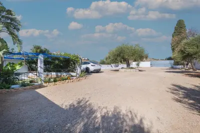 a parking lot with a car parked in it at Mirador de la Peña in Arcos de la Frontera