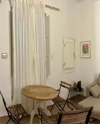 a living room with a table and chairs and a couch at nr15 in the heart of Cadiz in Cádiz
