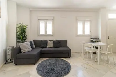 a living room with a couch and a table at Jerez Centro Stay in Jerez de la Frontera