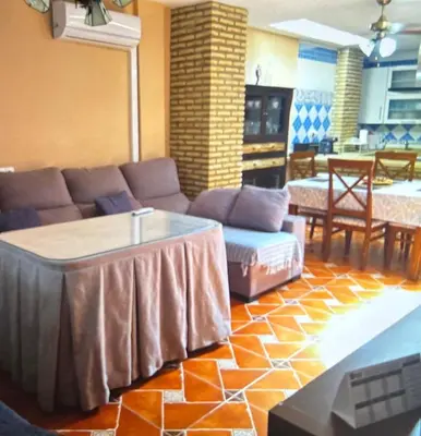 a living room with a couch and a table at Piso en el centro de sanlucar Bda in Sanlúcar de Barrameda