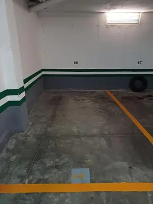 an empty parking garage with a yellow line on the floor at Apartamento Bahía de la Luz in Rota