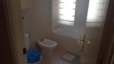 a small bathroom with a toilet and a sink at Piso a buen precio con 3 HABITACIONES in Puerto Real