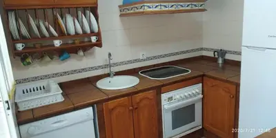 a small kitchen with a sink and a stove at Piso a buen precio con 3 HABITACIONES in Puerto Real