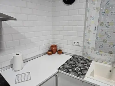a white bathroom with a sink and a shower at Casa El Canario by Sanlúcar Housing in Sanlúcar de Barrameda