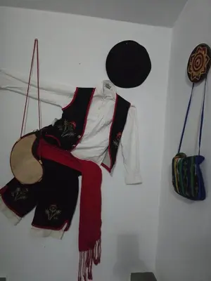 a white wall with clothes hanging on a wall at Casa El Canario by Sanlúcar Housing in Sanlúcar de Barrameda