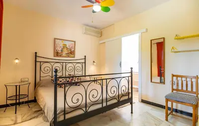 a bedroom with a bed and a ceiling fan at Stunning Home In Conil De La Frontera in Conil de la Frontera