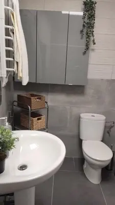 a bathroom with a white toilet and a sink at Loft los olivos in Algar