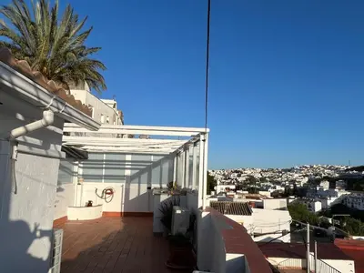 a balcony of a house with a view of the city at Casa Patricia I in Arcos de la Frontera