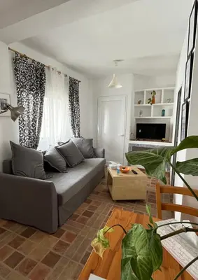 a living room with a couch and a table at Casa Patricia II in Arcos de la Frontera