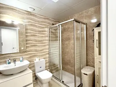 a bathroom with a shower and a toilet and a sink at Mi sueño free parking by staycare in Rota
