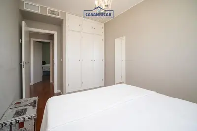 a bedroom with a bed and a sign on the wall at Atico Molinillo in Sanlúcar de Barrameda