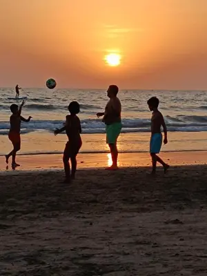 a group of people playing with a ball on the beach at Ocean Home - Costa Ballena in Costa Ballena
