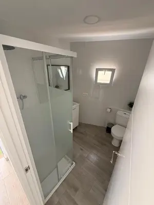 a bathroom with a shower and a toilet at Apartamento Bf Jerez in Jerez de la Frontera