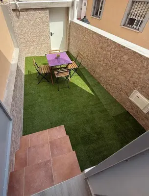 an overhead view of a patio with a table and chairs at Apartamento Bf Jerez in Jerez de la Frontera