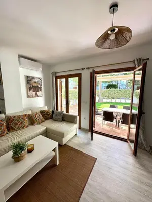 a living room with a couch and a table at El Ancla in Novo Sancti Petri