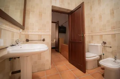 a bathroom with a sink and a toilet at Casa Rural Manuel Sevillano in Bornos