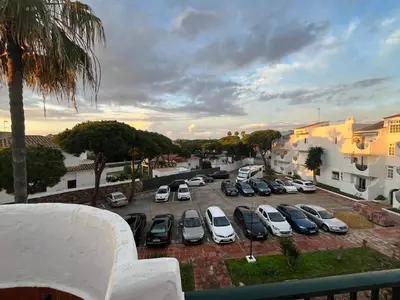 a parking lot with a bunch of cars parked at Frente al Mar, Tu Refugio Ideal in Novo Sancti Petri