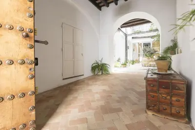 an empty room with an open door and a wooden cabinet at Mar Abierto B in Sanlúcar de Barrameda