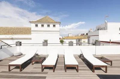 a row of benches on the roof of a building at Mar Abierto B in Sanlúcar de Barrameda