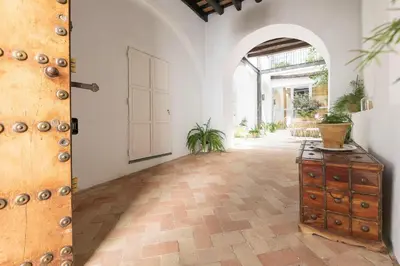 a room with an open door and a wooden cabinet at Mar Abierto A in Sanlúcar de Barrameda