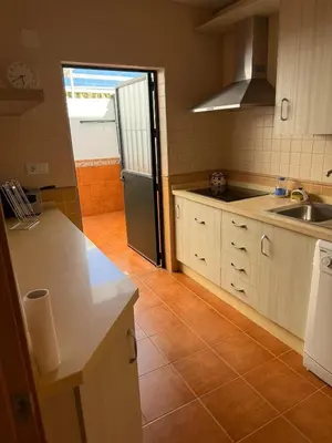 a kitchen with a sink and a counter top at Dúplex tras Regla in Chipiona