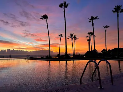 a view of the ocean at sunset at Hotel Punta Bermeja Premium in El Puerto de Santa María