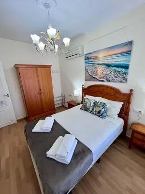 a bedroom with a bed with two towels on it at GATU Villa Flavia 