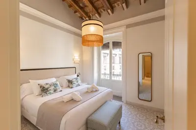 a living room with a couch and a table at Aladro Apartamentos by Valcambre in Jerez de la Frontera