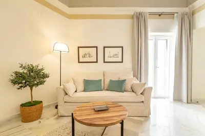 a hallway with a large floral mural on the wall at Aladro Apartamentos by Valcambre in Jerez de la Frontera