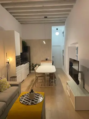 a living room with a couch and a table at Cádiz Paz in Cádiz