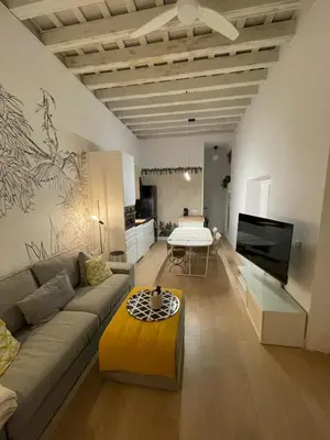a living room with a couch and a table at Cádiz Paz in Cádiz