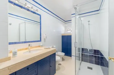 a room with two bunk beds and a window at Plaza del Cabildo Sanlucar Center by Valcambre in Sanlúcar de Barrameda