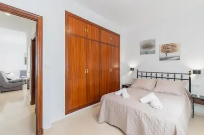 two bunk beds in a room with a window at Plaza del Cabildo Sanlucar Center by Valcambre in Sanlúcar de Barrameda