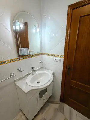 a bathroom with a sink and a mirror at El balconcito in Arcos de la Frontera
