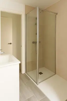 a glass shower in a bathroom with a sink at La Joya de Apartamento in Jerez de la Frontera