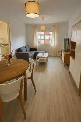 a living room with a couch and a table at La Joya de Apartamento in Jerez de la Frontera
