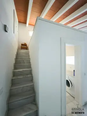 a staircase in a house with a glass door at Spinola Beachfront Bungalows - Apartamentos bungalow en primera linea de playa en Sanlúcar de Barrameda in Sanlúcar de Barrameda